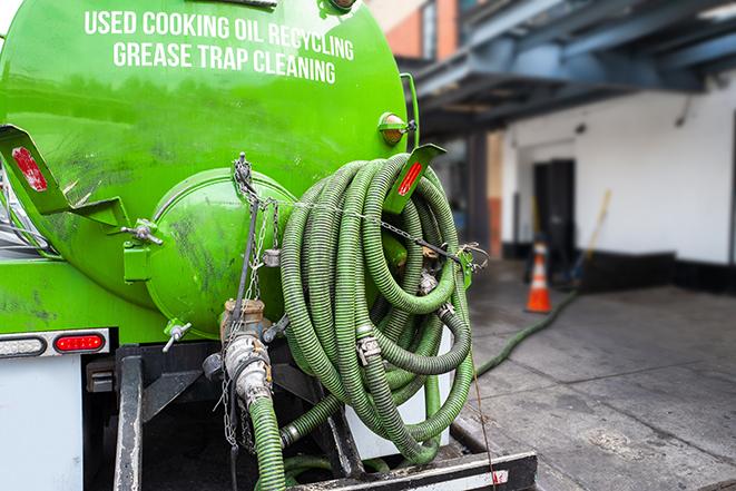 pump truck removing waste from a grease trap in Cordova